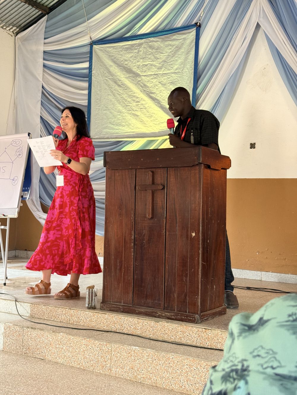 Jodi Ashcraft teaching, with a translator beside her