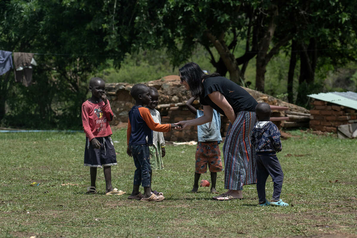 Jodi dancing with women in a village in Northeast Africa